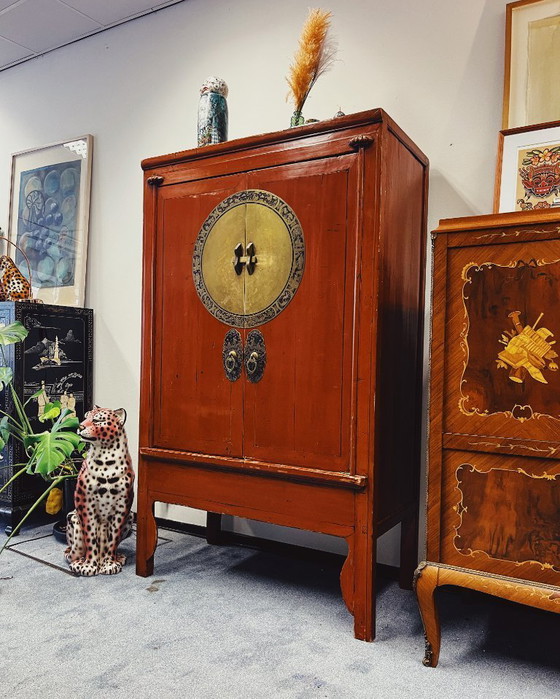 Image 1 of Antique red cabinet with brass details