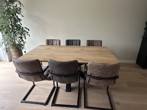 Solid wood dining table with steel spider legs and 6 chairs