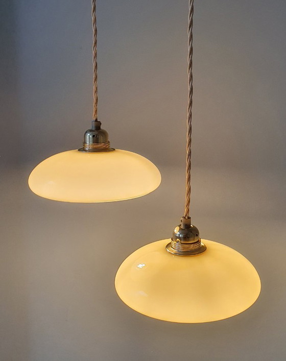 Image 1 of Vintage French pendant lamp set - of pastel yellow opaline glass.