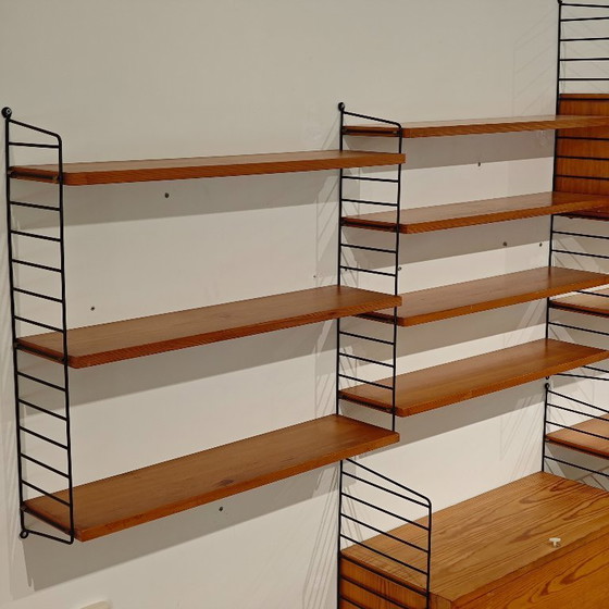 Vintage String wall system cabinet Nils Strinning | €1,550 | Whoppah