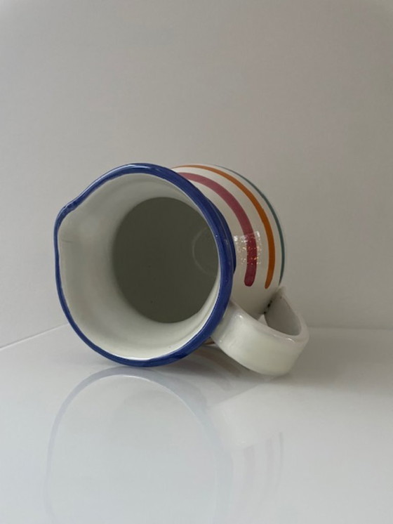 Image 1 of Handgemaakte vintage schenkkan met kleurrijke strepen