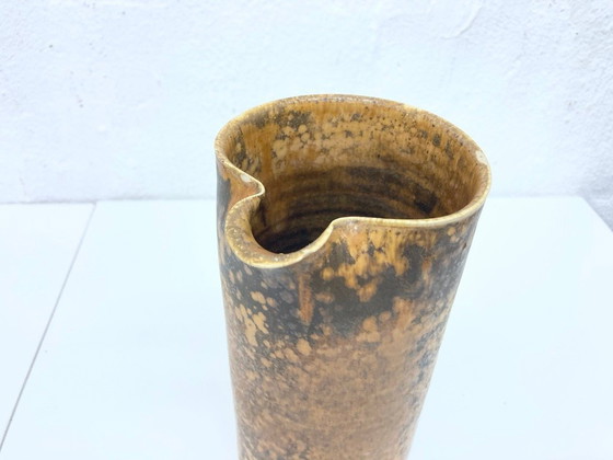 Image 1 of   1 jug and 4 mugs from the 50s 60s by Gotlind Weigel.  Ceramic.  Good used condition. Some chips to the rim