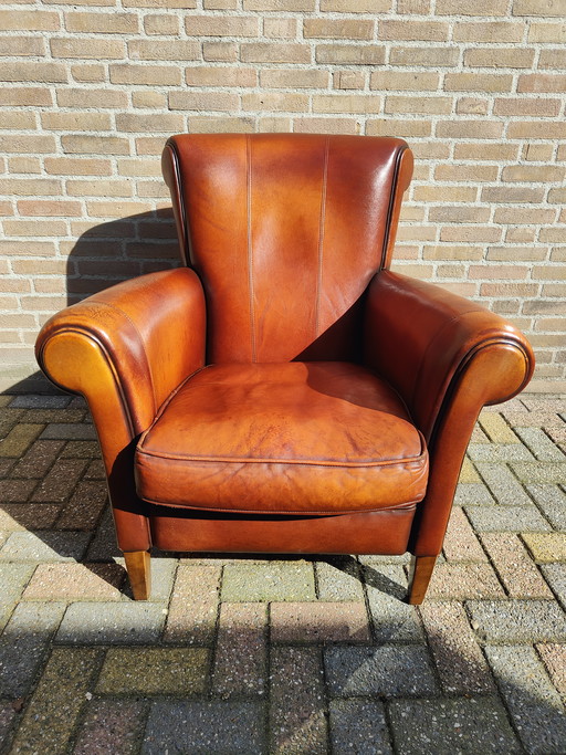 Fauteuil design en cuir de mouton Muylaert