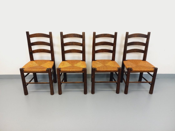Image 1 of Set van 4 vintage brutalistische stoelen van Georges Robert, gemaakt van hout en stro, uit de jaren 50 en 60.