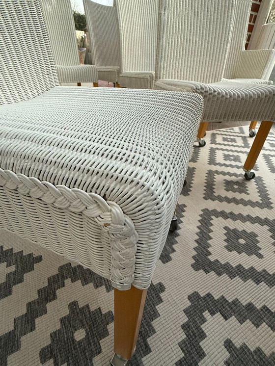 Image 1 of 8 originele Lloyd LOOM stoelen, eetkamerstoelen, ook in kleinere aantallen verkrijgbaar, houten frame, wit riet.