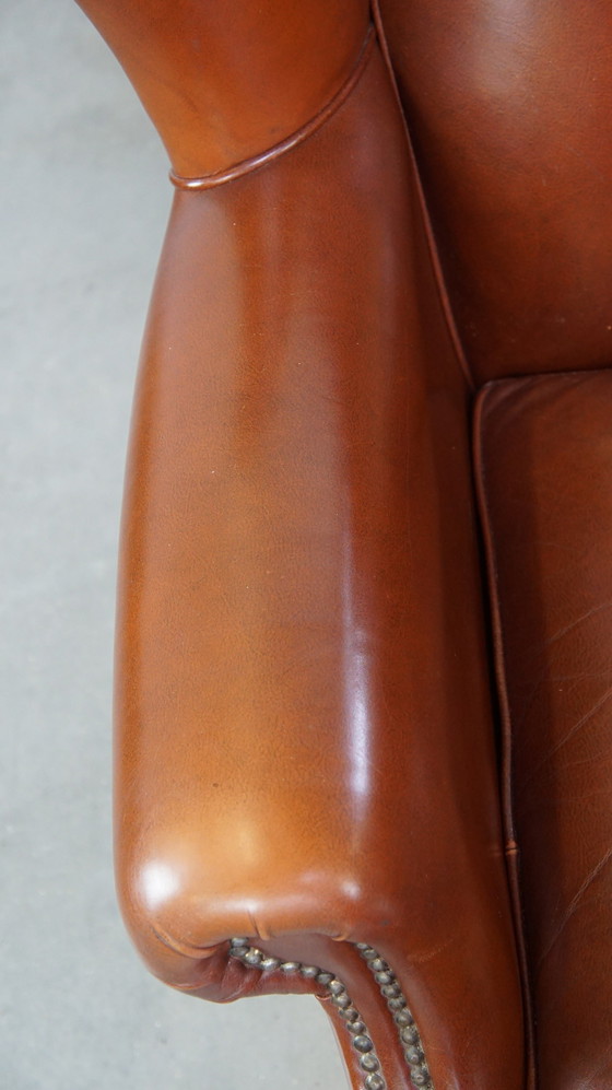 Image 1 of Fauteuil à oreilles en cuir de boeuf