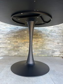 Round black wooden table with metal base juntoo