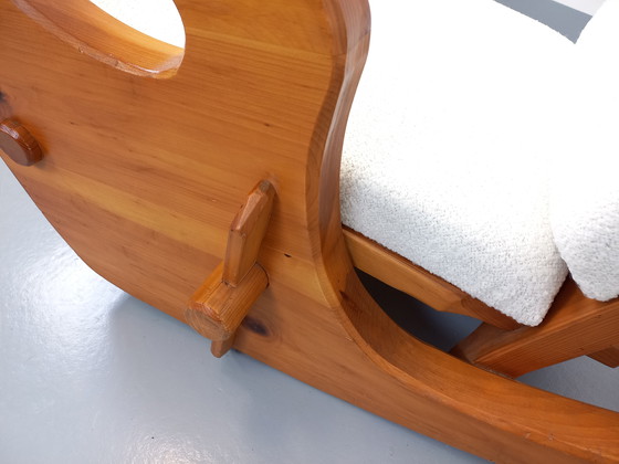 Image 1 of 50's Brutalistische Jean Touret schommelstoel in massief grenen en Bouclette stof