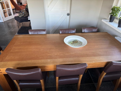 Wooden table with 8 chairs