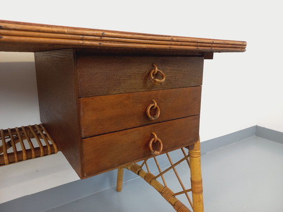 Image 1 of Vintage Louis Sognot bureau in rotan en hout uit de jaren 60