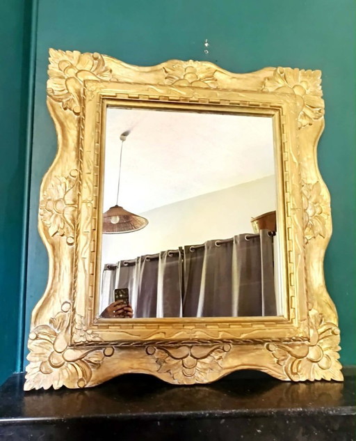 Large mirror in gilded wood