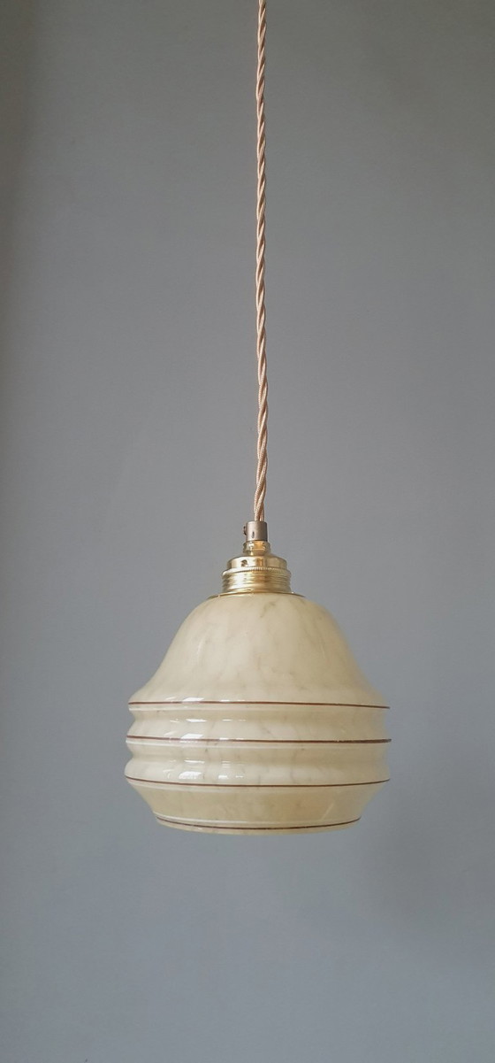 Image 1 of Vintage hanglamp - amberkleurig glas met spots en goudkleurige biezen.