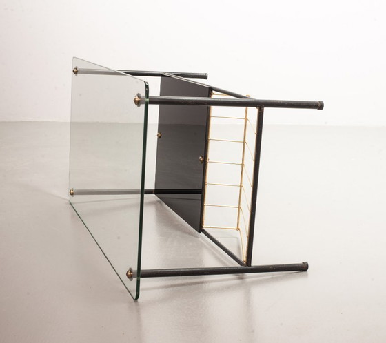 Image 1 of Mid-Century Pierre Guariche Glass Coffee / Side Table for Airborne in Black Steel with Brass Magazine Holder. France, 1950s. 