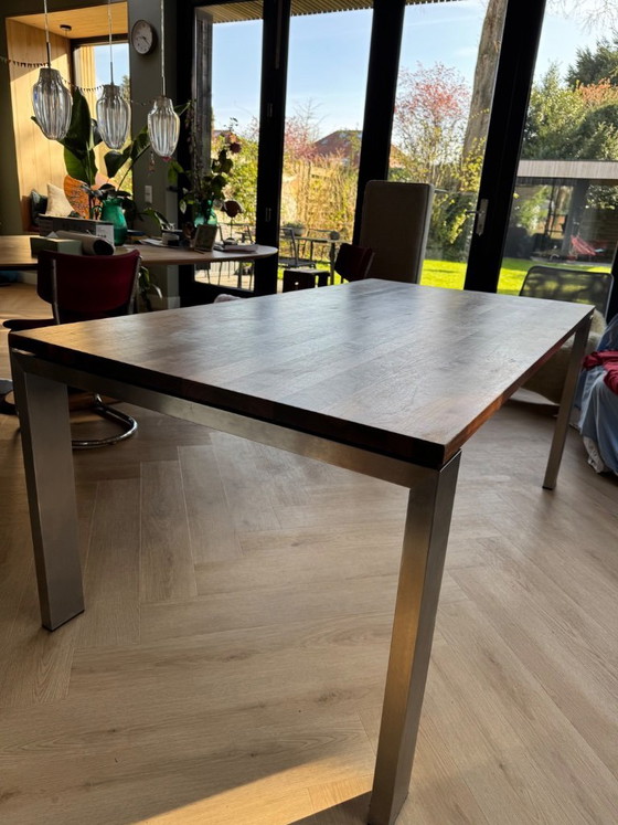 Image 1 of Walnut wood table with stainless steel legs