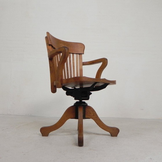 Silla de oficina de roble con sistema de muelles ajustable y regulación de altura, década de 1950. (photo 3 of 35)