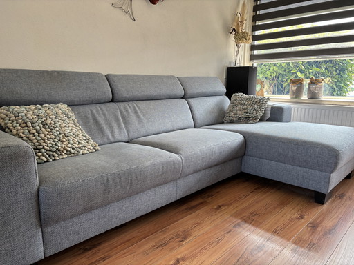 Sofa set with relaxing chaise longue