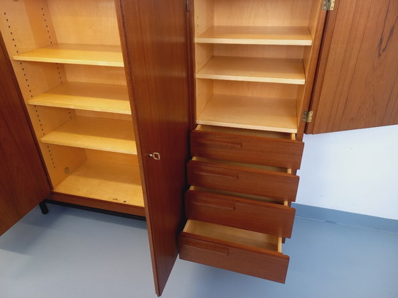 Image 1 of Tall, modernist, vintage Scandinavian sideboard in teak and black metal from the 1960s