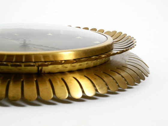 Image 1 of Beautiful original Mid Century Sunburst Atlanta Universe wall clock made of heavy brass with a mechanical seven-day movement