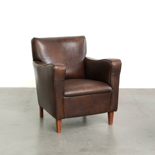 Fauteuil Subtil Foncé Vintage En Cuir De Mouton Avec Coussin Fixe Et Design Intemporel