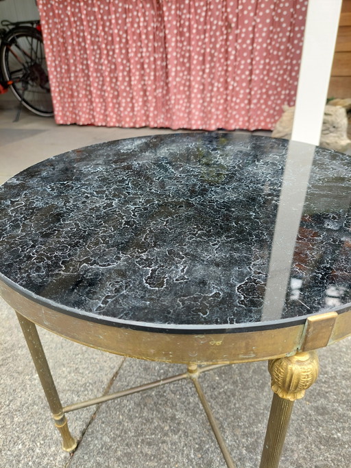 Antique brass so called coffee table with black marbled glass top
