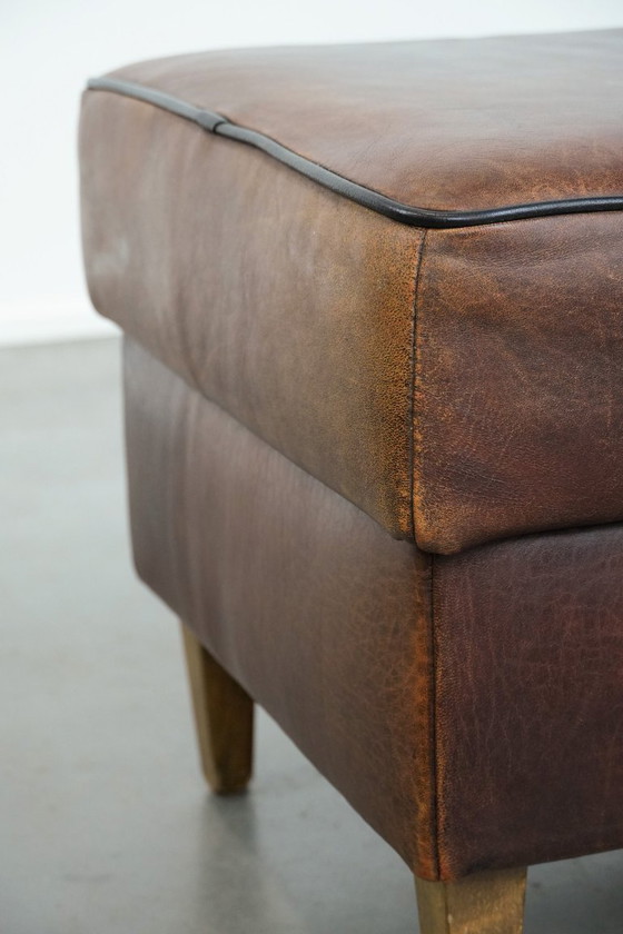 Image 1 of Vintage sheepskin stool with black piping