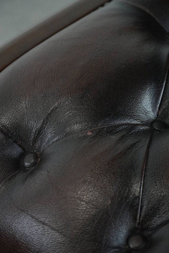 Image 1 of English-style Chesterfield office chair made of cowhide and wood on wheels