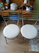 Four stainless steel chairs with boucle fabric