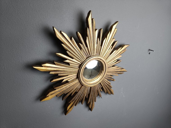 Image 1 of Beautiful resin sunburst mirror with convex mirror glass.  The golden mirror is in a good condition.  1960s - made in Belgium.  