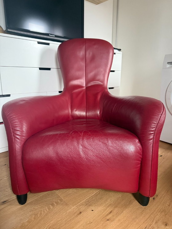 Image 1 of Montis Loge fauteuil met voetenbank in rood leer 