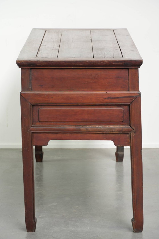 Image 1 of Antique wooden Chinese sideboard from the late 19th century in a beautiful red color with exquisite wood carving.