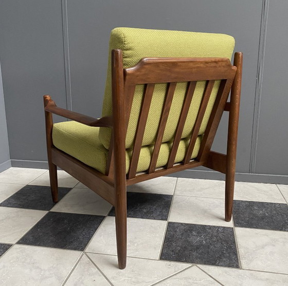 Image 1 of Gele stoffen en houten relaxstoel uit de jaren 60.