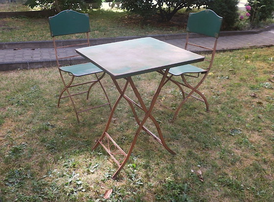 Image 1 of Table de jardin et 2 chaises en fer peint vieilli, style années 1960