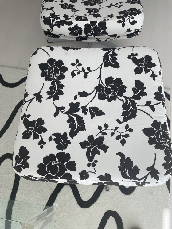 Image 1 of Black and white floral armchair with footstool