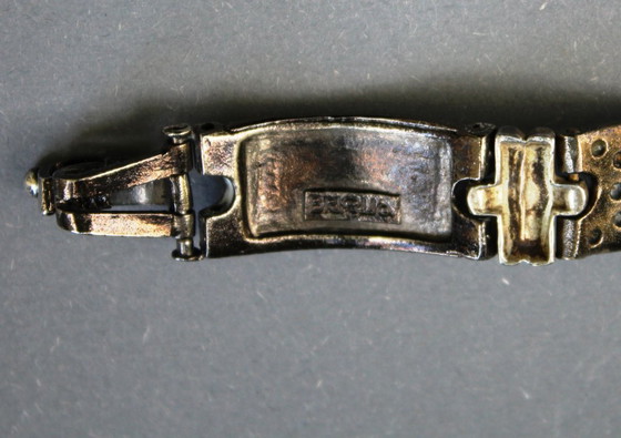 Image 1 of Bracelet by Luigi Briglia, silver-colored, set with clear, faceted stones and signed.