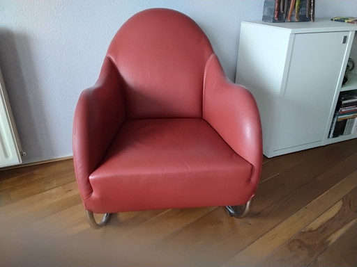 Red leather armchair by Wittmann.
