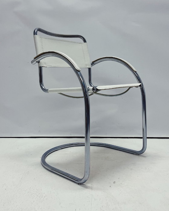 Image 1 of Vintage tubular frame chairs with white skai