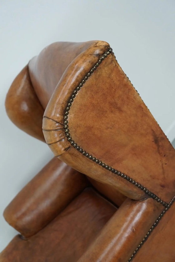 Image 1 of Vintage Nederlandse cognackleurige leren clubfauteuil met voetenbank