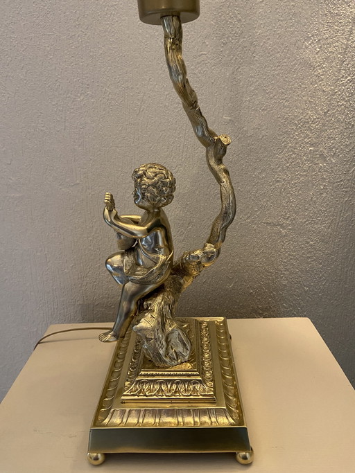 Bronze table lamp depicting a cherub playing the guitar