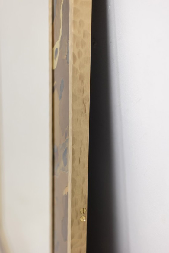 Image 1 of Mirror in marquetry of oxidized and patinated brass. Artist's work
