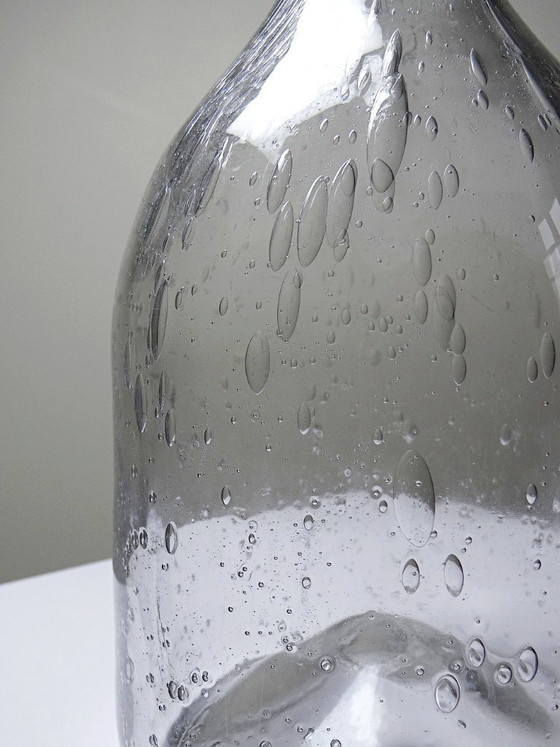 Image 1 of Large antique bottle in blown glass with bubbles, early 20th century, 1900-1920
