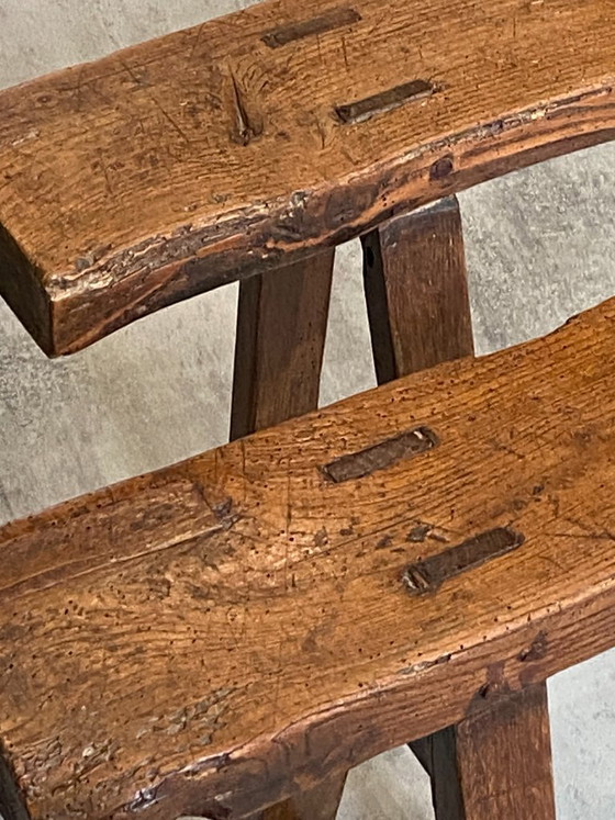 Image 1 of Twee massief eikenhouten boerenbanken van 214 cm voor een rustieke boerentafel uit de jaren 50.