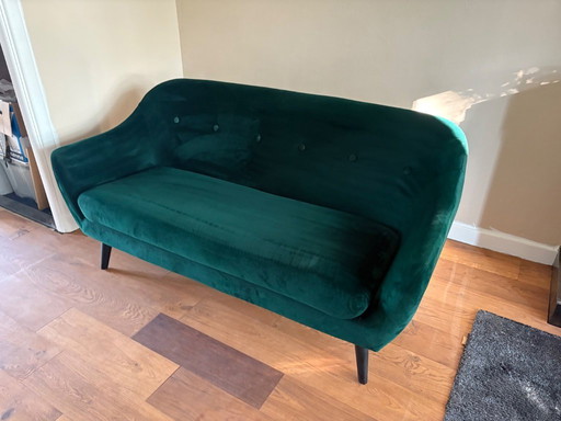 Groen fluwelen bank