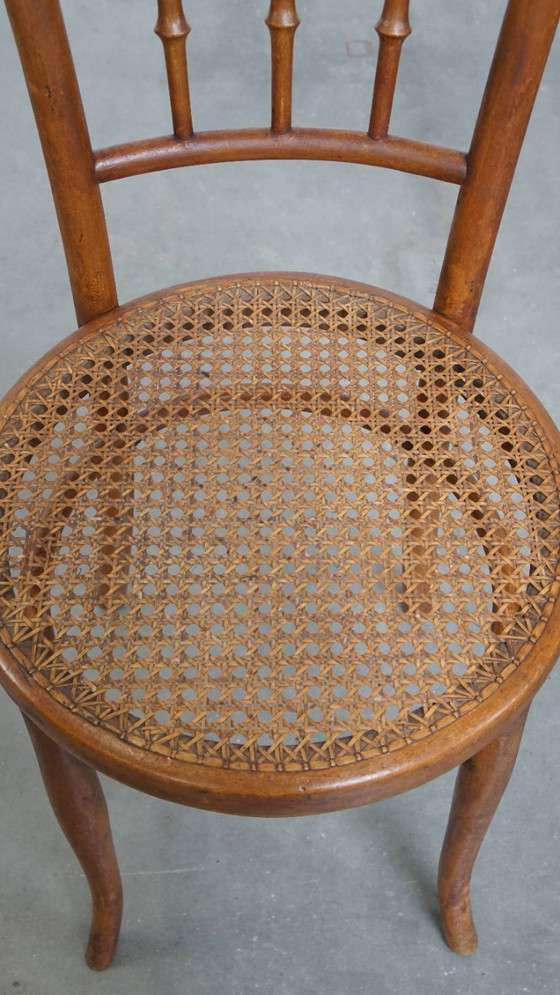 Image 1 of Vintage bistro stoel in de stijl van Thonet met een rieten zitting