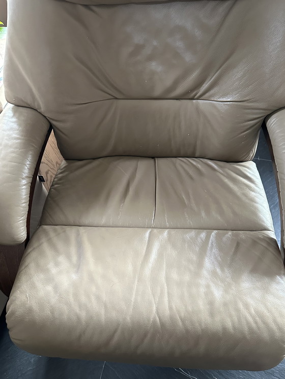 Image 1 of Taupe armchair with footstool