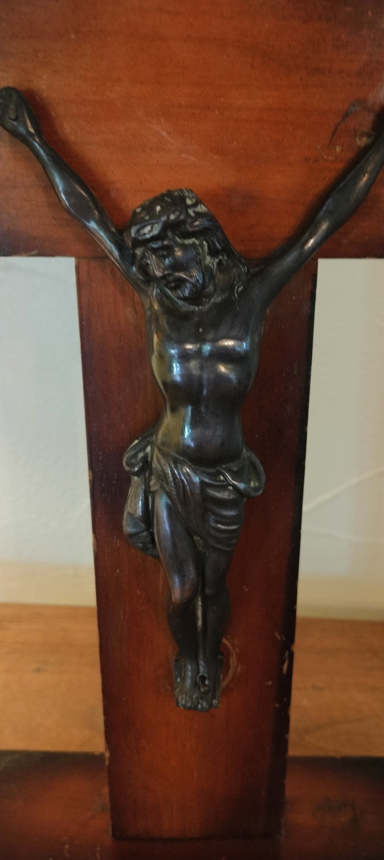 Image 1 of Small copper crucifix on a wooden plank