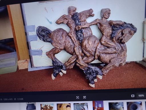 Butalist wall decoration men on horses