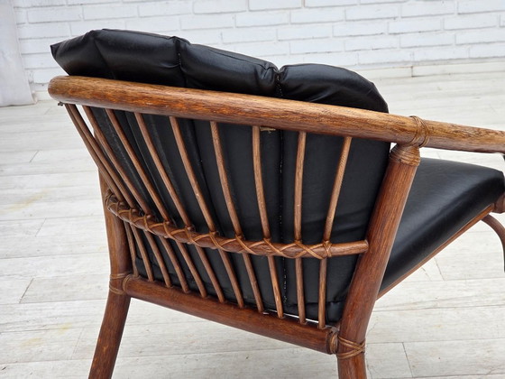 Image 1 of 1970s, Danish armchair, rattan, black artificial leather.
