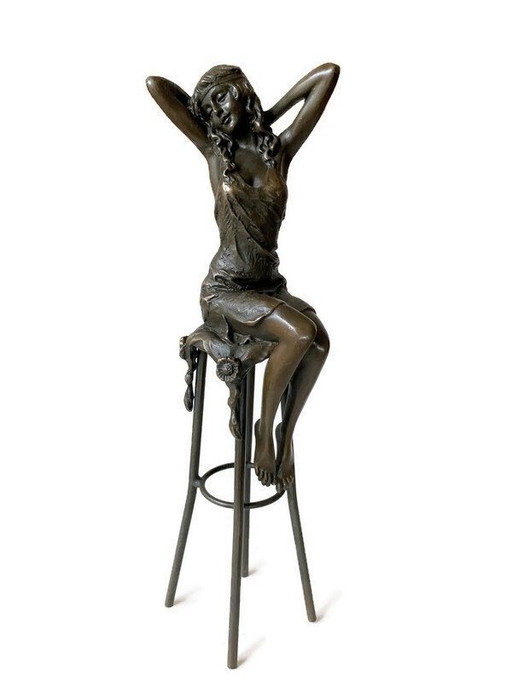 Bronze lady on chair