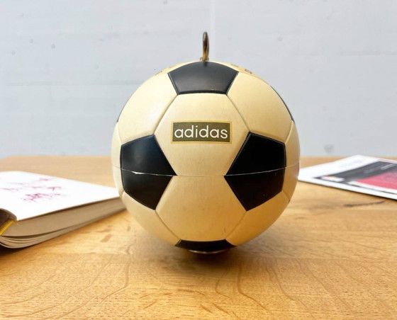 Image 1 of Vintage Adidas cigarette dispenser from the 1970s