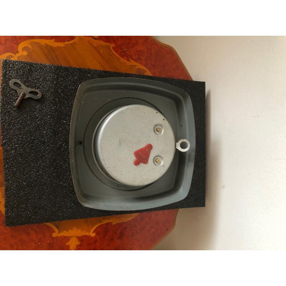 Image 1 of Vintage hes wall clock in heavy metal case, India